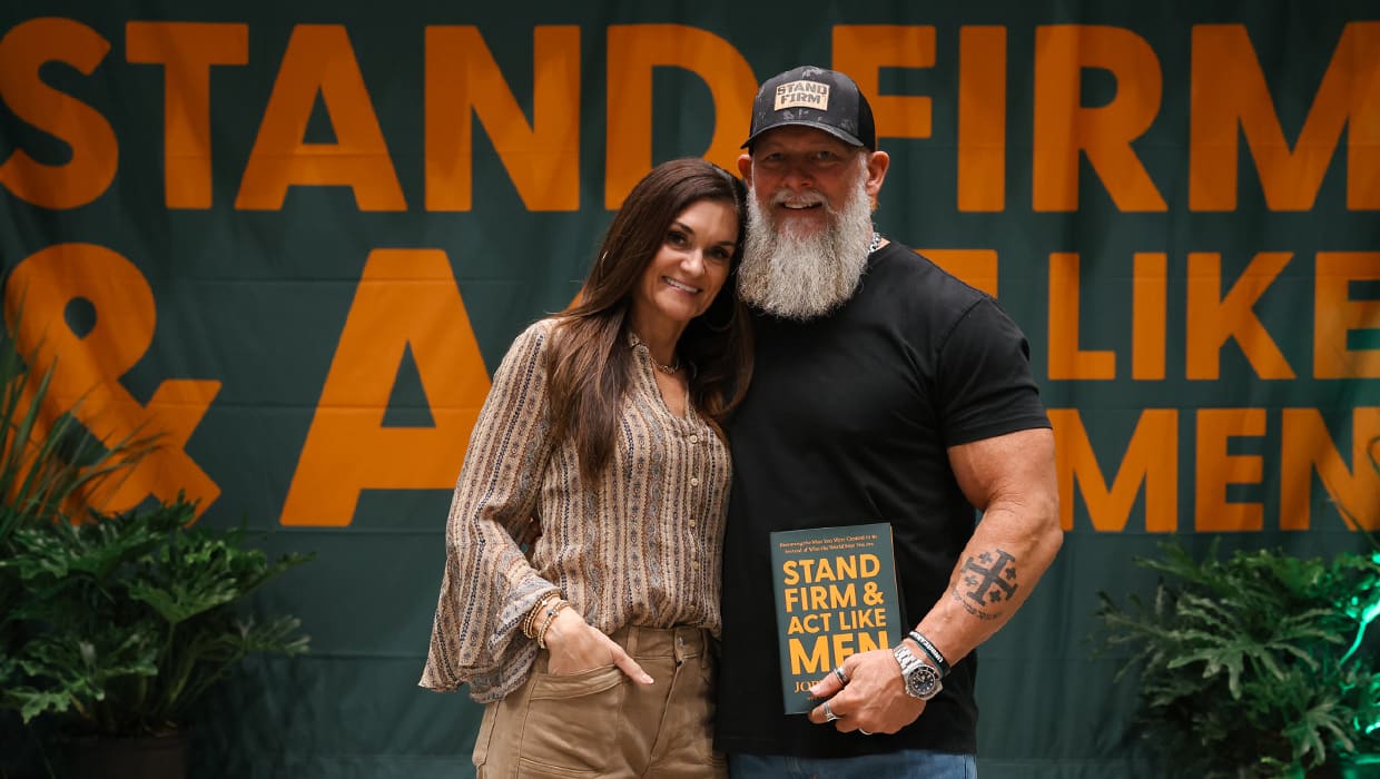 Joby Martin holding his book Stand Firm and Act Like Men