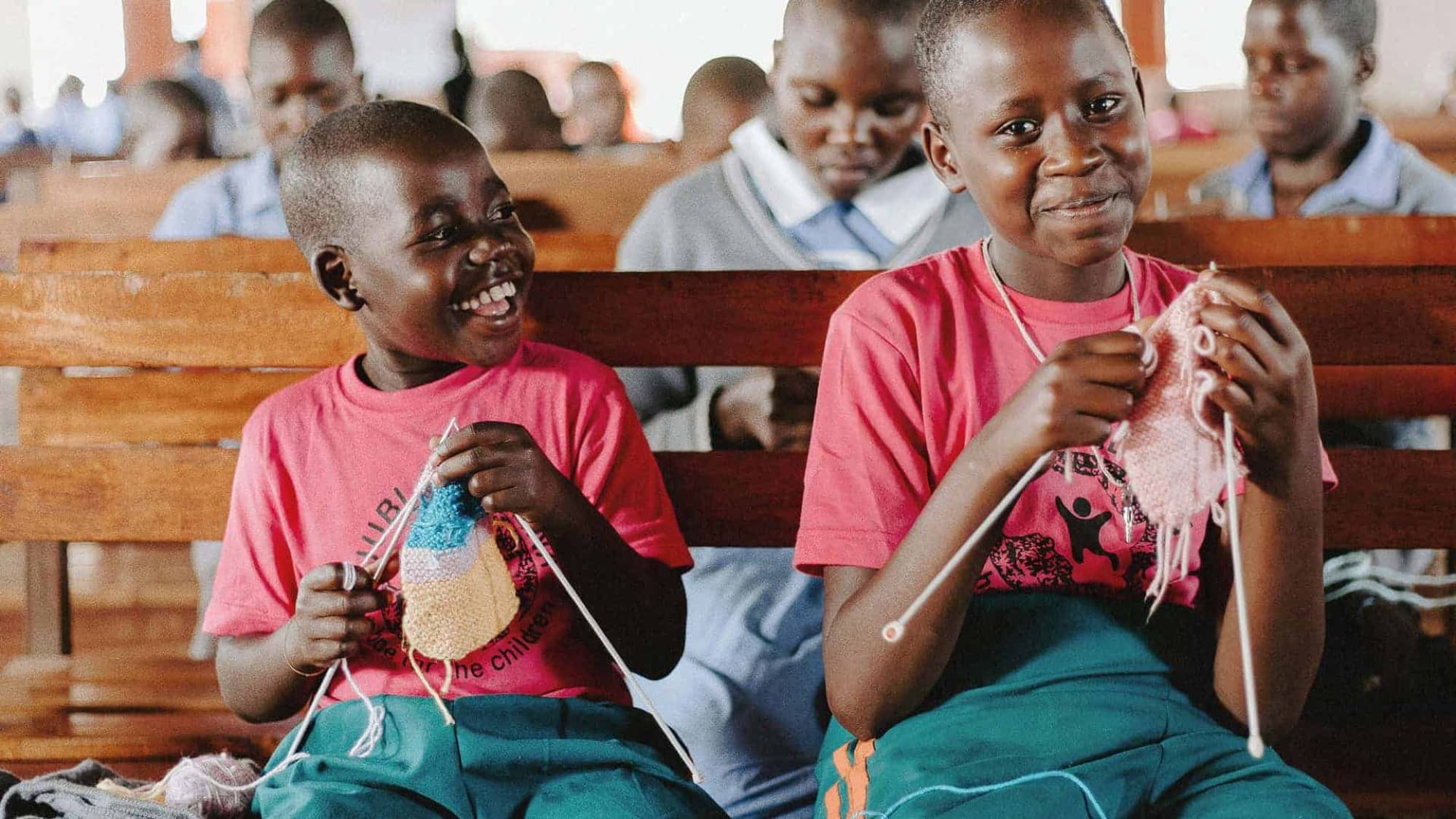Two boys laughing during a mission trip in Uganda